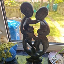 Listing image for Shona stone sculpture from Zimbabwe, Serpentine Stone Family of 4 15" x 8".